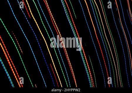 Abstract colorful background. Light painting lines. Colorful lights pattern on black background. Long exposure photography. Stock Photo
