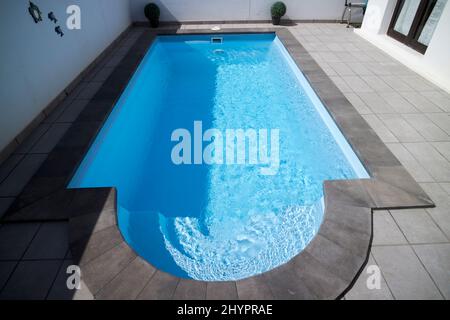 small private swimming pool of a villa in a residential complex playa blanca lanzarote, canary islands, spain Stock Photo