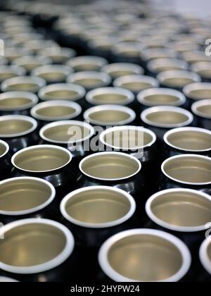 Background of many beer cans in a factory Stock Photo