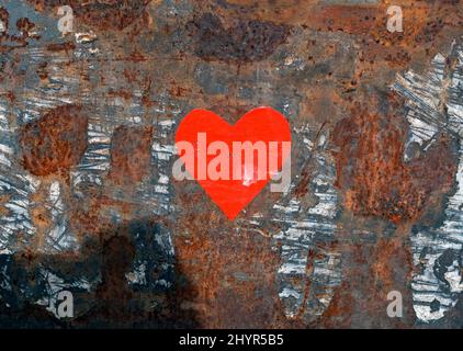 Red heart shape painted on rusted steel metal Stock Photo