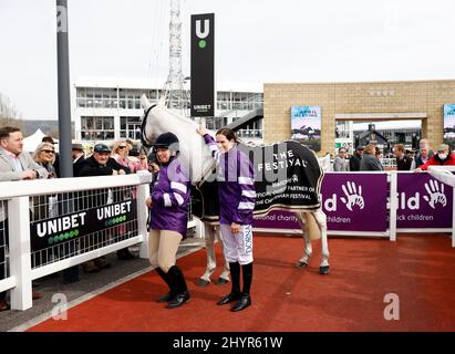Jockey Rachael Blackmore (right) and Sarah Haydon with Well Child ambassador for the festival Smad Place during day one of the Cheltenham Festival at Cheltenham Racecourse. Picture date: Tuesday March 15, 2022. Stock Photo