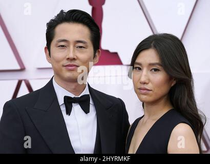 Steven Yeun and Joana Pak at the 93rd Annual Academy Awards held at Union Station on April 26, 2021 in Los Angeles. Chris Pizzello-Pool/ML/AFF-USA.COM Stock Photo
