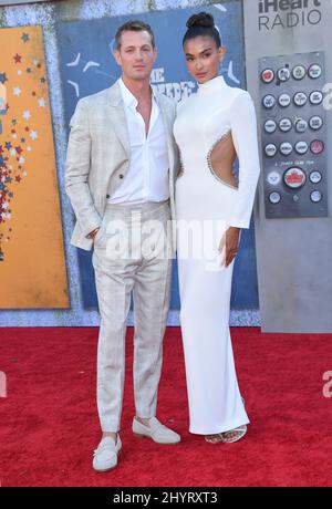 Joel Kinnaman and Kelly Gale at 'The Suicide Squad' premiere held at the Regency Village Theatre on August 2, 2021 in Westwood, CA. Stock Photo