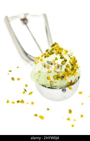 Pistachio ice cream in ice cream spoon on a white background Stock Photo
