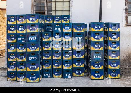 Side, Turkey -February 20, 2022: close-up of empty glass bottles of Efes in branded crates ready for recycling Stock Photo