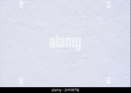 detail of a white plastered wall with a rough appearance Stock Photo