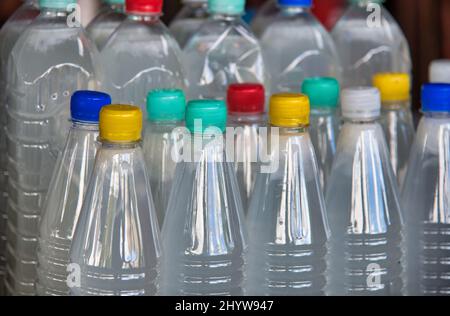 Plastic bottles with colourful caps. Stock Photo