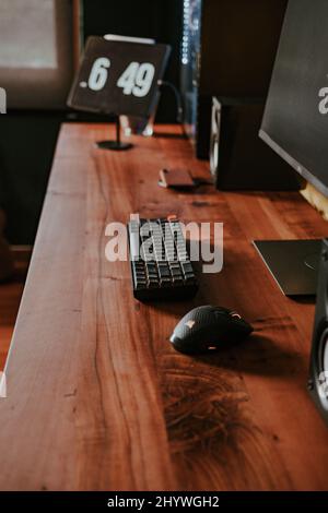 Closeup shot of PC on a wooden table in a room Stock Photo