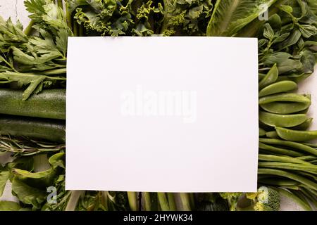 Directly above shot of fresh green vegetables on table with copy space Stock Photo