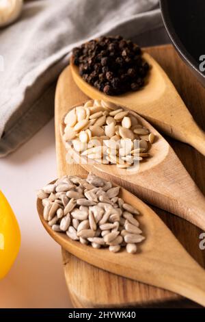 Close-up of various spices in wooden spoons on table, copy space Stock Photo
