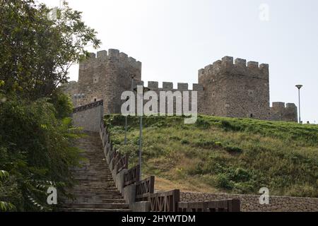 Scenic view of stone stairs leading to the Fortress Platamon on top of a green hill Stock Photo