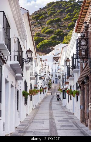 Typically alee street in famous village Mijas , with white house and isolated bars. Malaga Spain Stock Photo