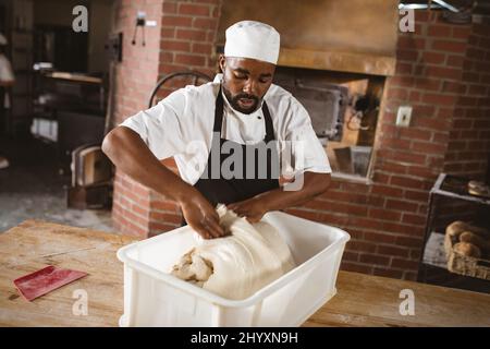 Handsome African American Baker Tray Fresh Loaves Bread Baking Manufacture  Stock Photo by ©ArturVerkhovetskiy 186864520