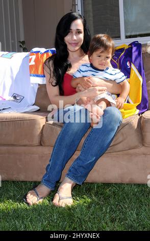 Nadya "Octomom" Suleman and her child at a yard sale held at her home