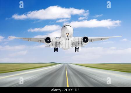 Big airplane aircraft flying departure landing speed motion on a runway in the good weather with cumulus clouds sky day Stock Photo