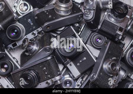 Many old retro cameras are in the pile. Collection. Vintage Stock Photo