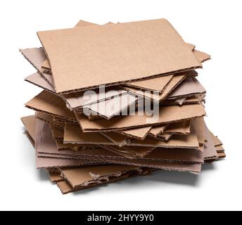 Pile of Cardboard Pieces Cut Out on White. Stock Photo