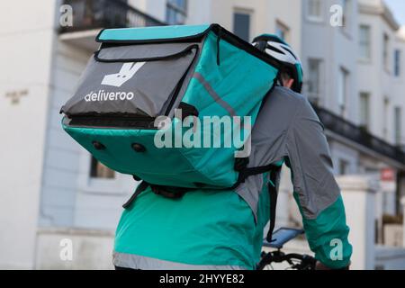 Deliveroo courier in Brighton, East Sussex Stock Photo