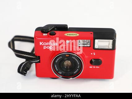 A red Konica pop 35 mm camera at a camera museum, Vadstena, Sweden. Stock Photo