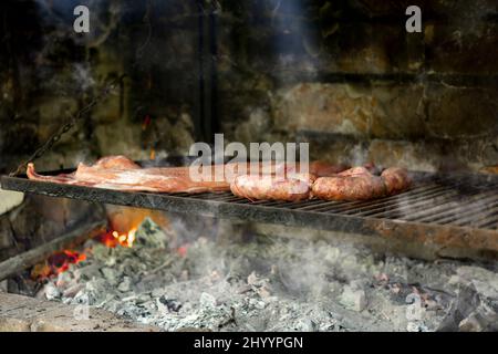 'Parrillada' Argentinian barbecue made on the grill (without flame), 'veal roast', 'Chorizo' Stock Photo