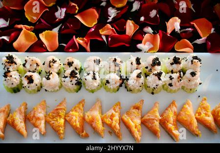 Selection of two cocktail hors d'oeuvre on decorated tray Stock Photo