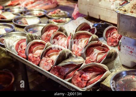 Cut and open fish heads being sold at a wet market in Hong Kong, China. Stock Photo