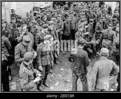 Nazi German prisoners of war from the Jager-Regiment 229 of the 101st division of the Nazi Wehrmacht, captured by units of the US 7th Army in Nevers, France. September 13, 1944 after the allied invasion on D-Day in June 1944 The main purpose of the German Jäger Divisions was to fight in adverse terrain where smaller, coordinated units were more easily combat capable than the brute force offered by the standard infantry divisions. Stock Photo