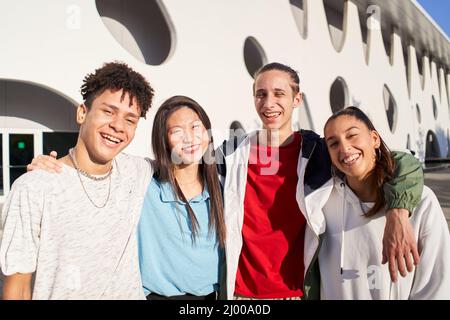 Portrait of a group of students smiling looking at the camera.  Stock Photo