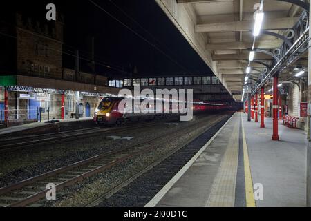 A Virgin Trains west coast Bombardier Voyager train at Lancaster railway station on the West Coast mainline Stock Photo