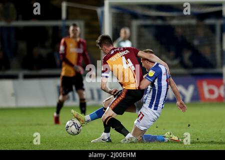 HARTLEPOOL, UK. MAR 15TH Hartlepool United's Marcus Carver battles for possession with Bradford City's Paudie O'Connor during the Sky Bet League 2 match between Hartlepool United and Bradford City at Victoria Park, Hartlepool on Tuesday 15th March 2022. (Credit: Mark Fletcher | MI News) Credit: MI News & Sport /Alamy Live News Stock Photo