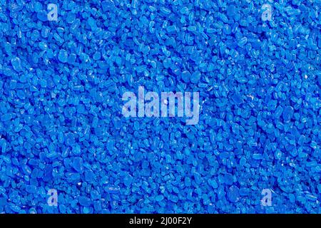 full frame background and texture of blue copper sulfate granules - close-up Stock Photo