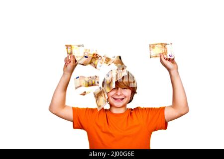 Euros flying around a boys head Stock Photo