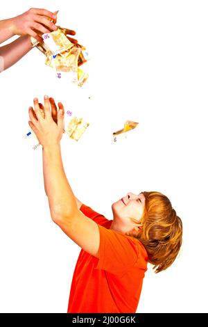 Euros flying around a boys head Stock Photo