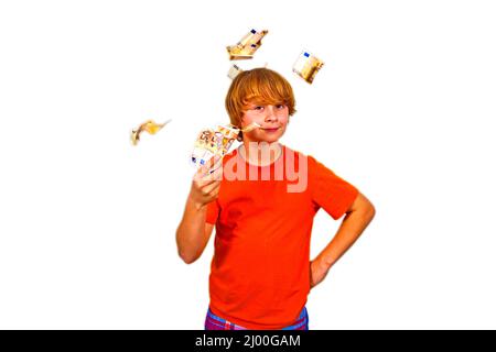 Euros flying around a boys head Stock Photo