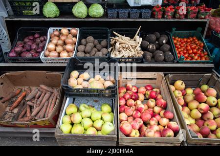 Fruits and veggies on a stand at open air flea market Stock Photo