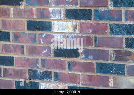 red brick wall with old damaged bricks Stock Photo