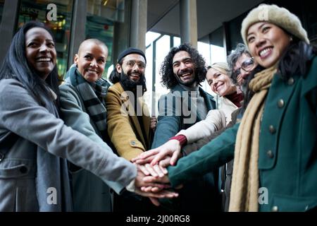 Group of business people outdoors joying hands celebrating success at work. Stock Photo