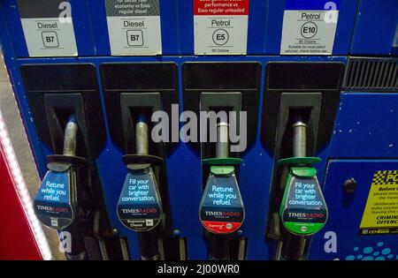 Beaconsfield, Buckinghamshire, UK. 15th March, 2022. Drivers were paying 166.9 per litre for petrol and 179.9 per litre for diesel an Esso petrol station in Beaconsfield this evening as a tank of petrol nears £100. Many drivers are shopping around to find petrol stations selling fuel at cheaper costs following the spike in fuel costs due to the Russian invasion of Ukraine. Credit: Maureen McLean/Alamy Live News Stock Photo