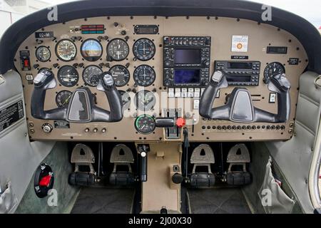 Detail of the cockpit of the old plane. Aircraft equipment, various indicators, buttons, instrument pedals. Aircraft instrument panel at the pilot Stock Photo