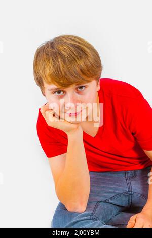 cool leisure young teenage boy with his head in his hands Stock Photo