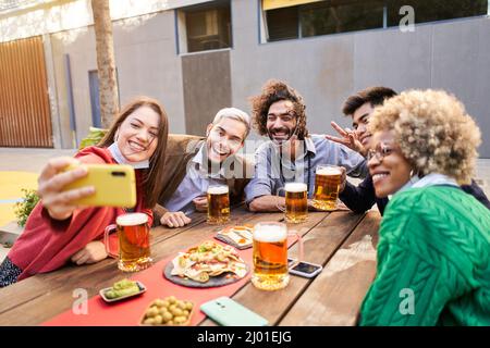 Selfie of young smiling teenagers having fun together Stock Photo