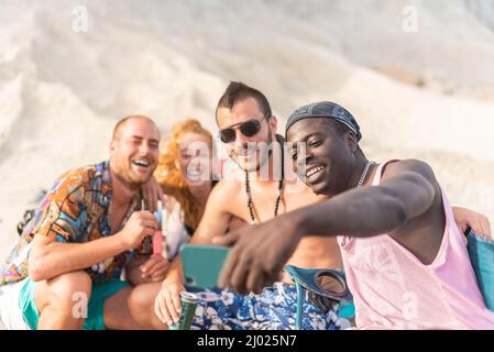 four friends having fun and posing for a selfie Stock Photo