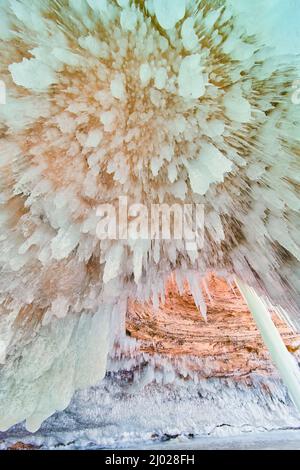 Circular icicle pattern on ceiling of ice cavern Stock Photo