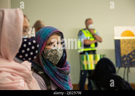 Christchurch, New Zealand. 15th Mar, 2022. A woman seen listening to speakers at the Al Noor Mosque on the third anniversary of the attacks. Temel Atacocugu, who was shot nine times during the Mosque attacks walked from Dunedin to Al Noor Mosque arriving at exactly 1.40 pm on the third anniversary of one of New Zealand's days. A ceremonial presentation was held at the Mosque where he received one of four Best In Project Awards. Credit: SOPA Images Limited/Alamy Live News Stock Photo