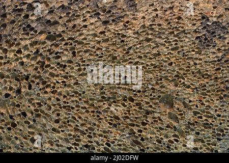 Black pumice stone texture for foot care, horizontal format Stock Photo