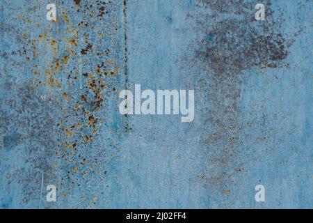 Metal texture with different degrees of corrosion. Old and rusty surface structure of the metal painted with blue paint, high resolution. Stock Photo