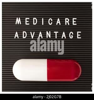 Medicare advantage. Motivational quote on letter board Stock Photo