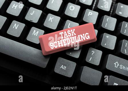 Writing displaying text Task Scheduling. Word for The assignment of start and end times to a set of tasks Abstract Typist Practicing Speed Typing Stock Photo