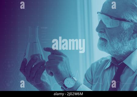 Scientist doctor researcher examining chemical sample working laboratory.Senior chemistry working Covid-19 vaccine research concept. Stock Photo