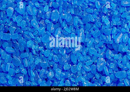 full frame background and texture of blue copper sulfate granules - close-up Stock Photo